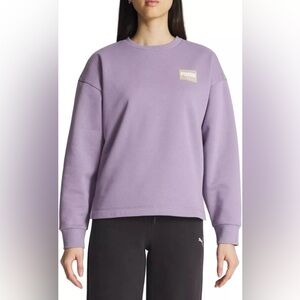 PUMA Women's Fleece Crewneck
Sweatshirt Badge, S purple